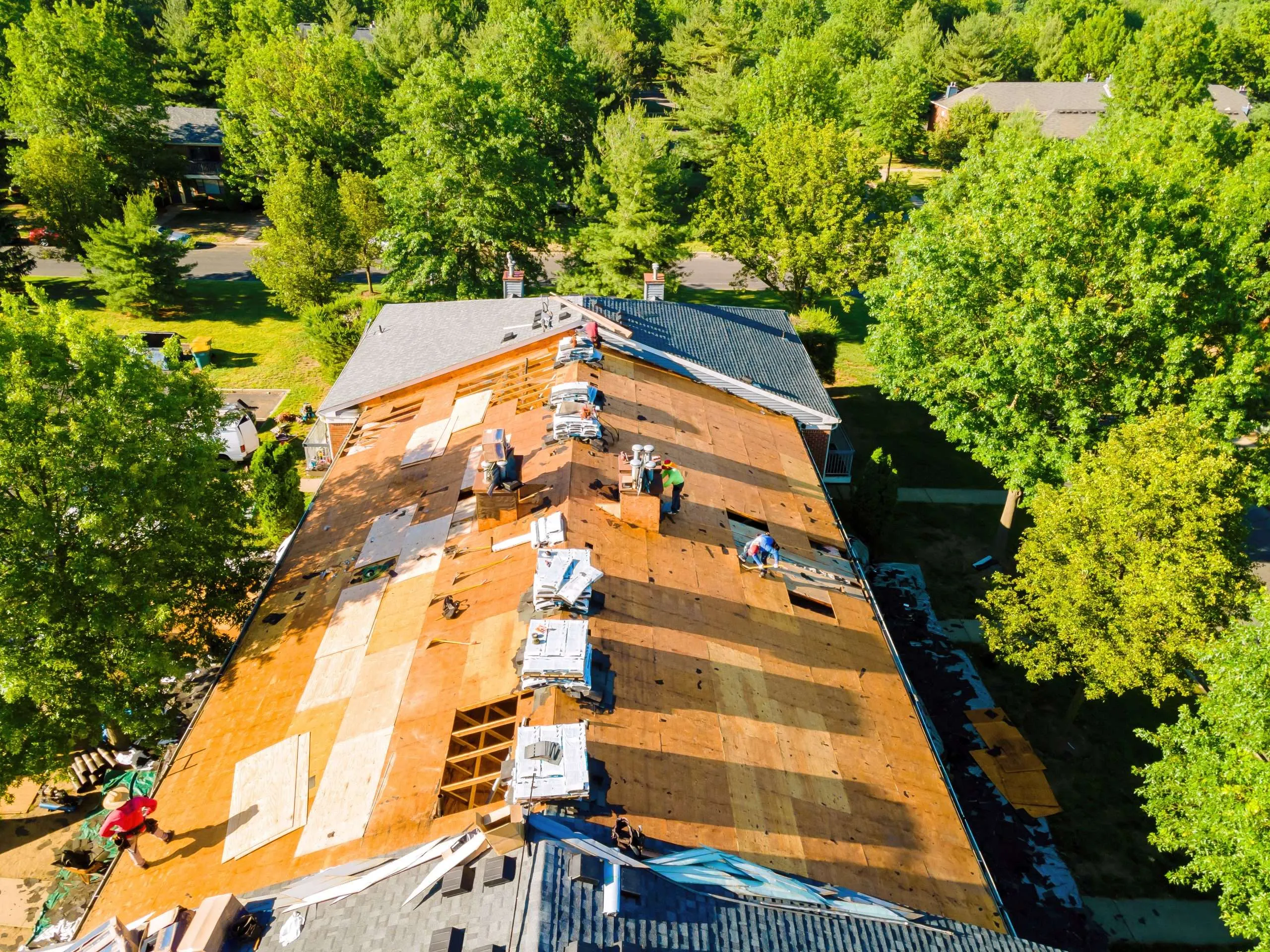 During repair of apartment buildings roof, new shingles were installed and old ones were replaced with plywood. 24/7 Emergency Roof Repairs in Florida